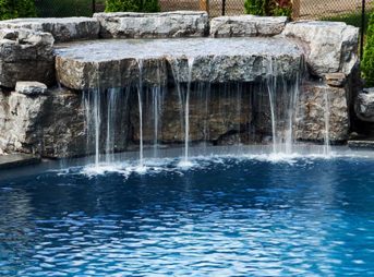 Outdoor-inground-pool-with-waterfall-built-in-Mono-Ontario
